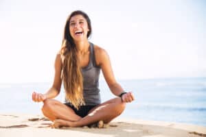 How To Better Yourself, Woman Doing Yoga On The Beach