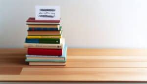 Stack of books with Decluttering Quotes