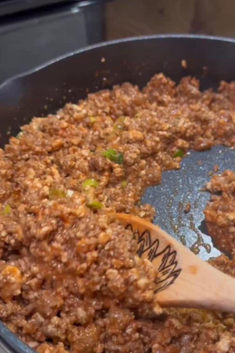 Sloppy joe meat simmering in a pan with peppers and onions, showing a classic family dinner made lighter for weight watchers recipes.