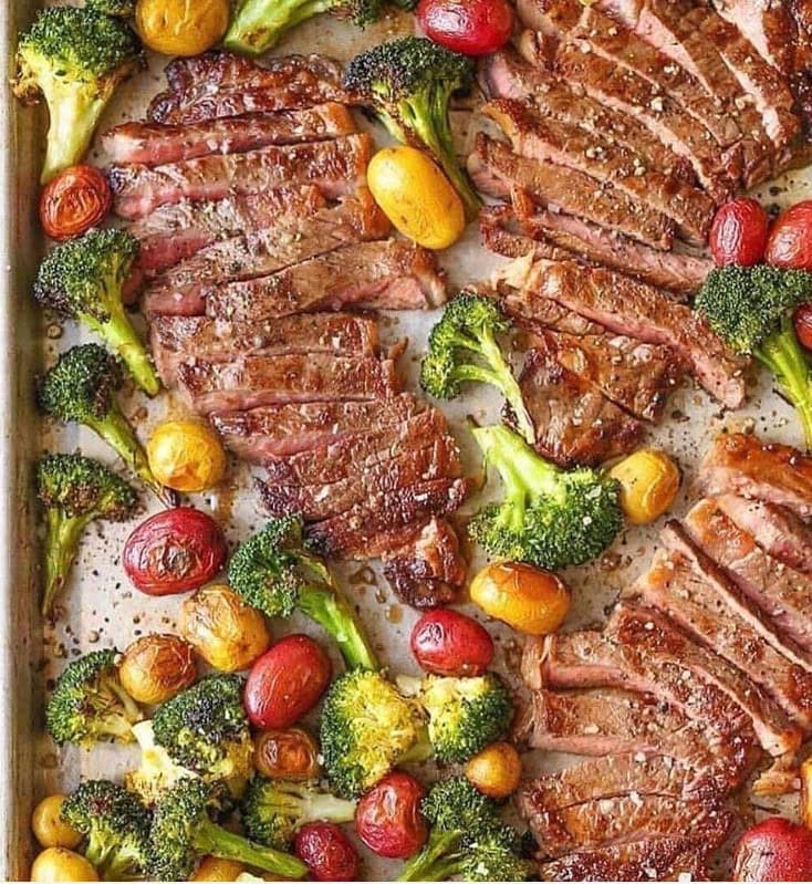 Steak and potatoes on sheet pan with other veggies