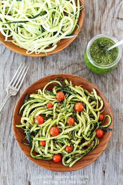 Spiralized zucchini noodles coated in a fresh, herby pesto sauce for a light and flavorful dish.