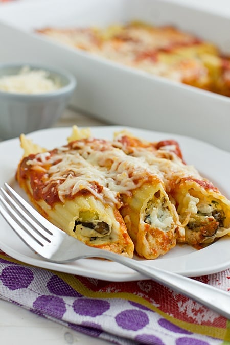 Cheese and roasted vegetable-stuffed manicotti baked in marinara sauce for a comforting meal are one of the best vegetarian recipes dinner. 