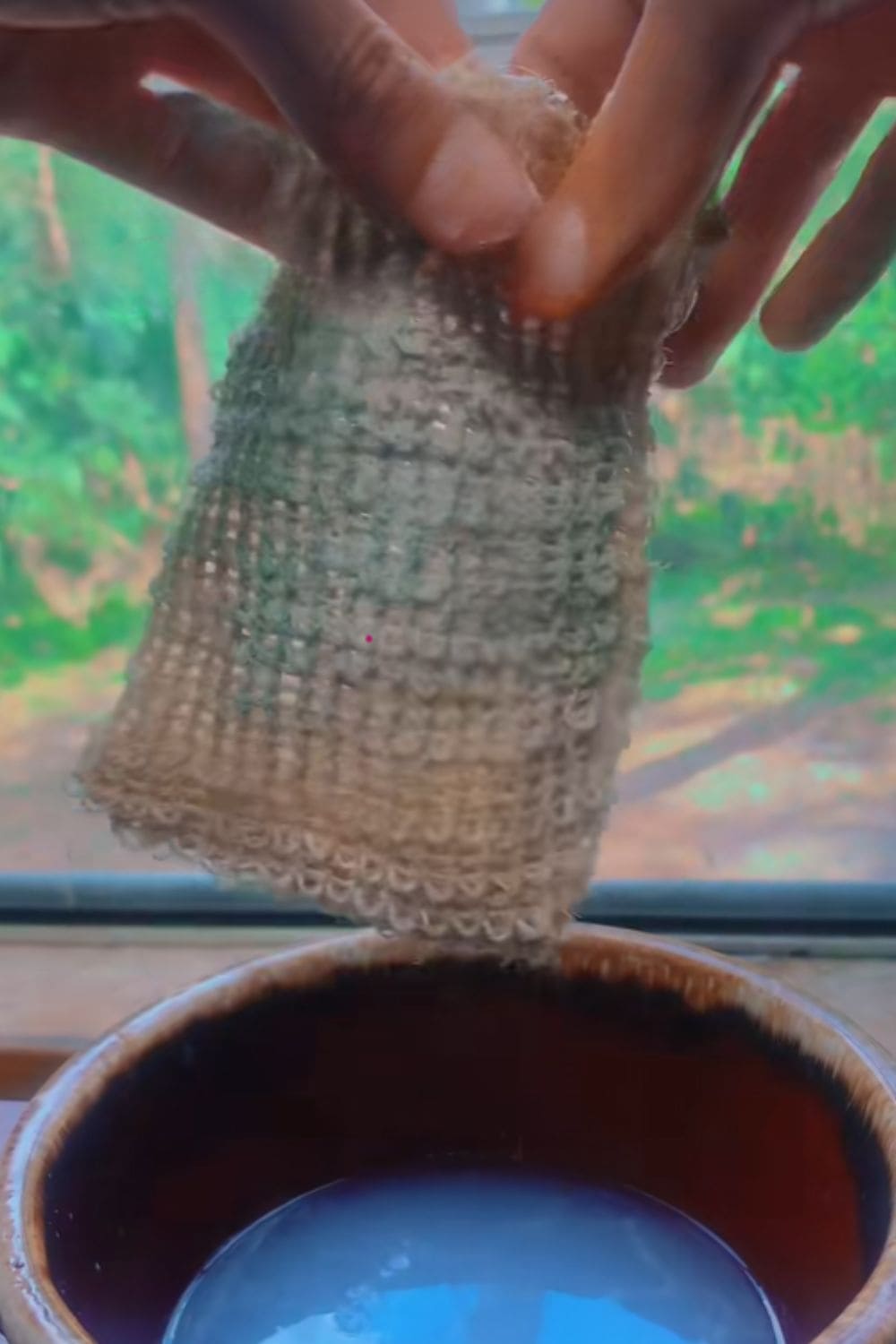 Loofah puff holding leftover soap pieces, a practical dollar store hack that helps use every last bit without waste.