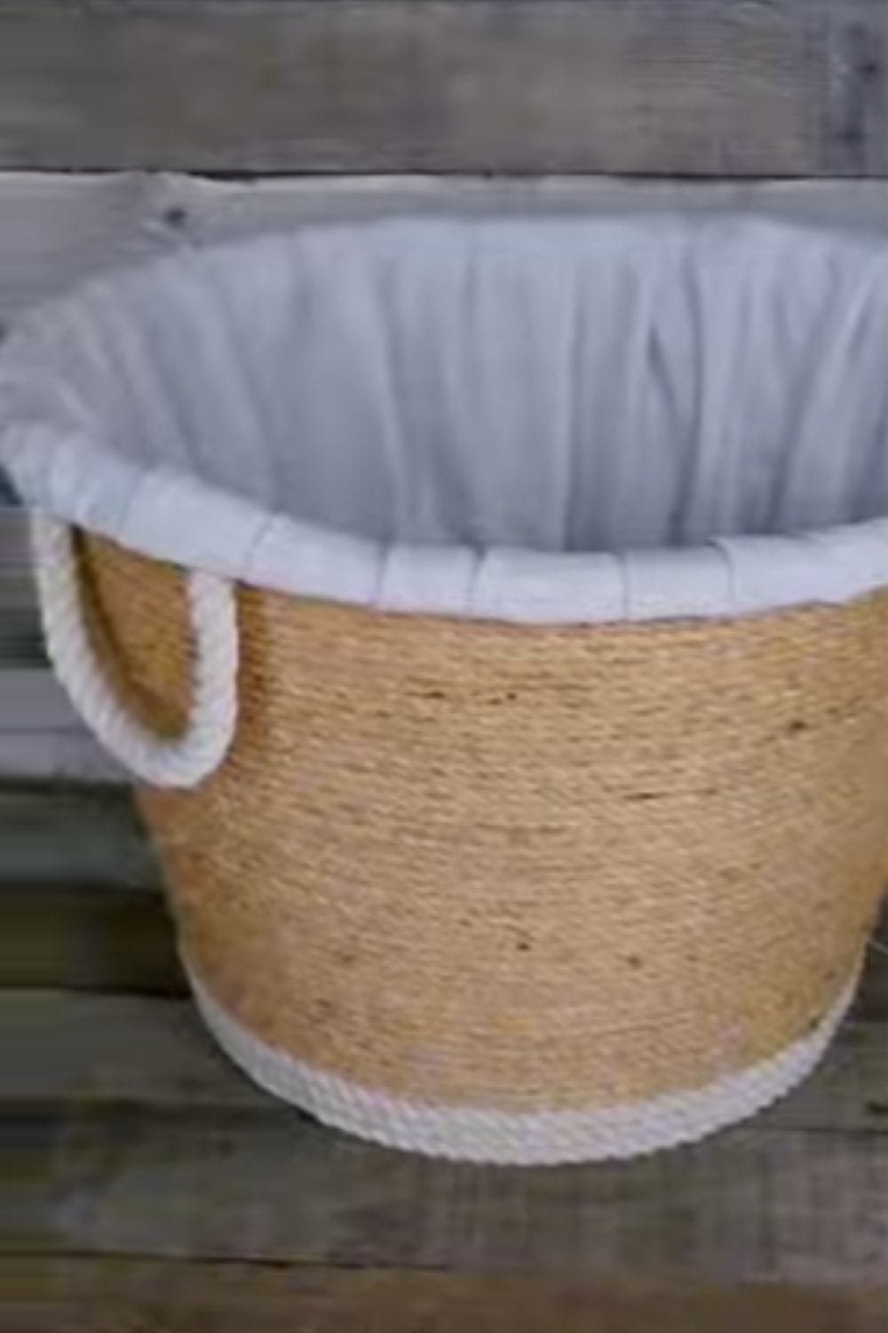 Clothes basket wrapped in twine and material inside