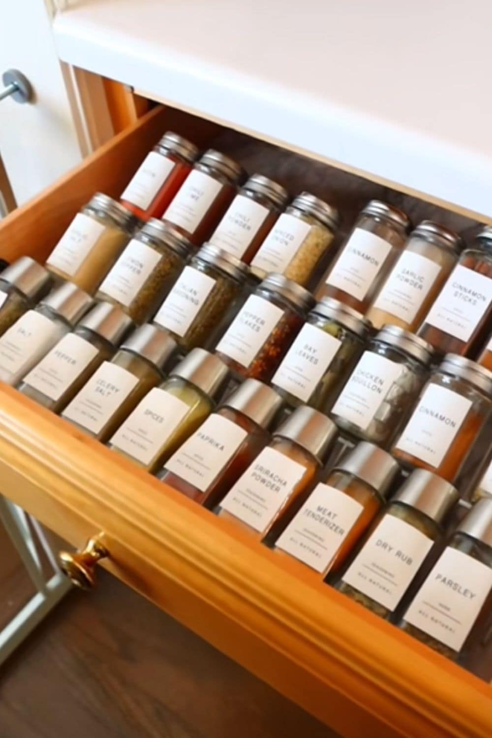 Spices neatly organized in a kitchen drawer using one of my favorite dollar store hacks to make cooking easier and keep cabinets clutter-free.