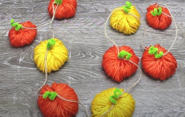 50 Dollar Tree Fall Decor Ideas To Transform Your Budget 13 Hanging Yarn Pumpkin Garland