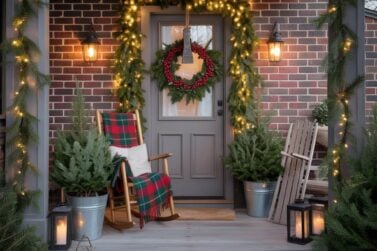 winter porch ideas - rocking chair, wreath on door, garland down posts, sled leaning on post