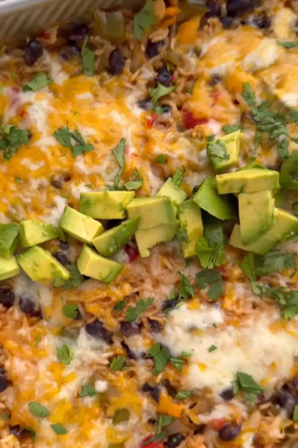 Rice and black beans baked with cheese and veggies in one dish, a simple and budget-friendly choice from our dump and bake recipes list.