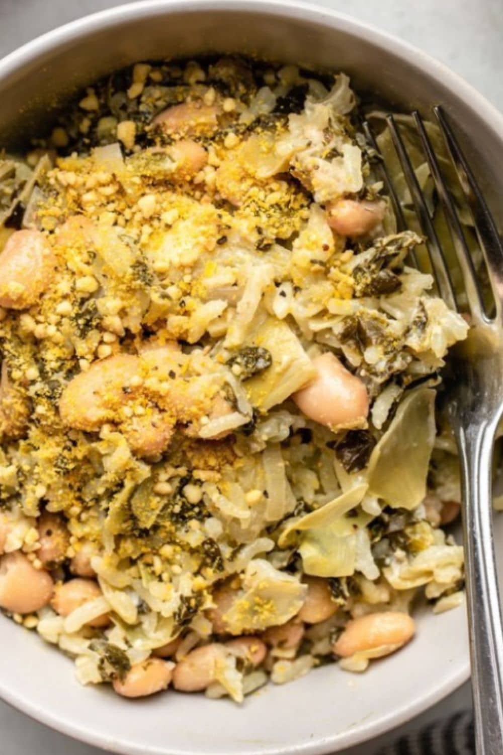 Creamy vegan spinach and artichoke casserole baked until cozy and melty, a comforting twist on dump and bake recipes.