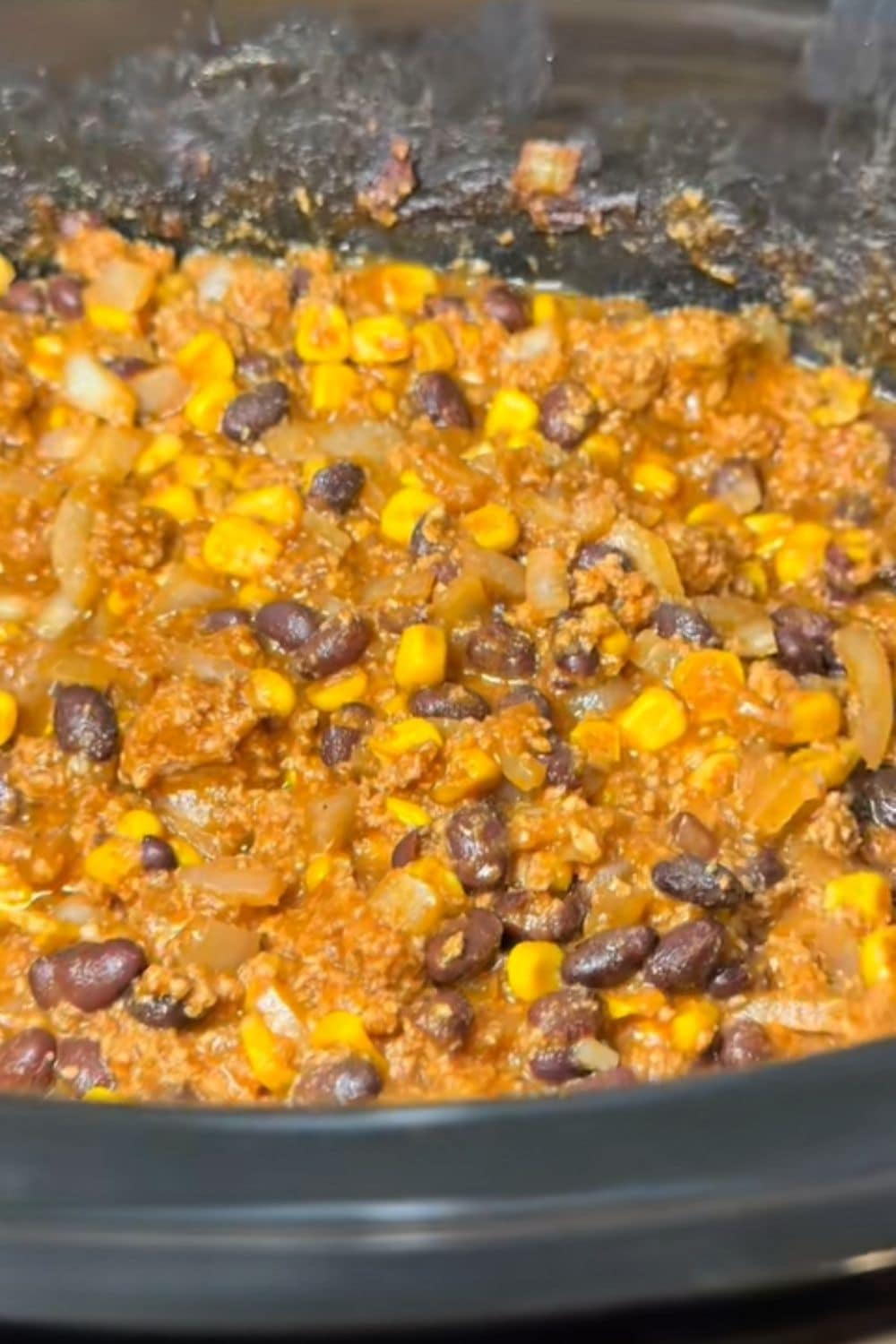 Healthy dump and go crockpot turkey taco meat cooking in the slow cooker, an easy and protein-packed dinner for busy weeknights.