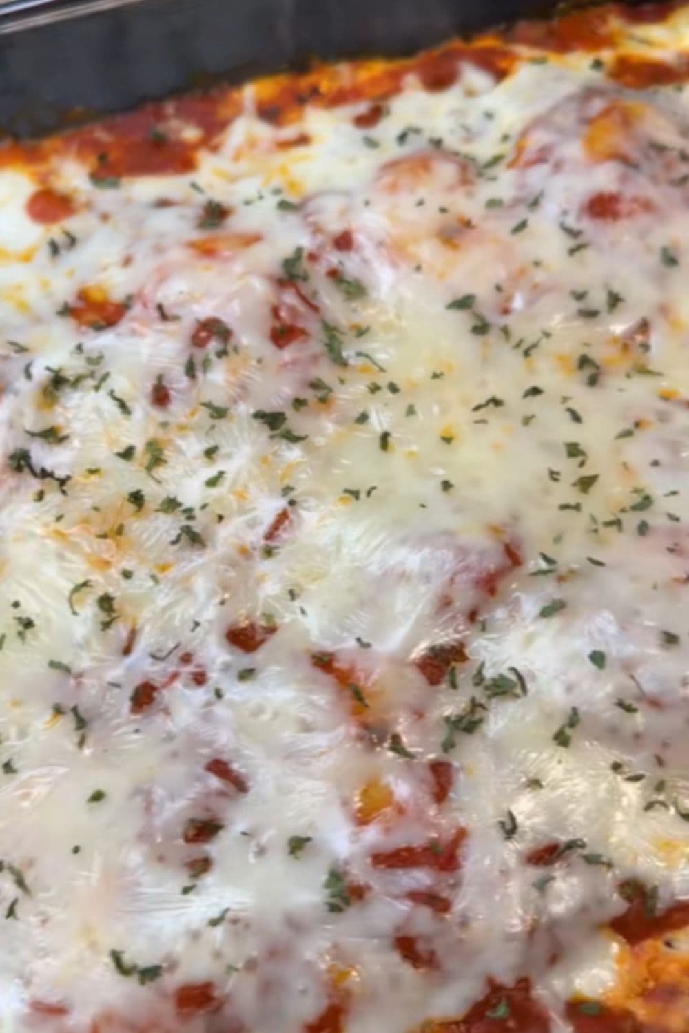 Layered ravioli lasagna with melty cheese and rich sauce, an ultra-easy comfort meal from our dump and bake recipes.