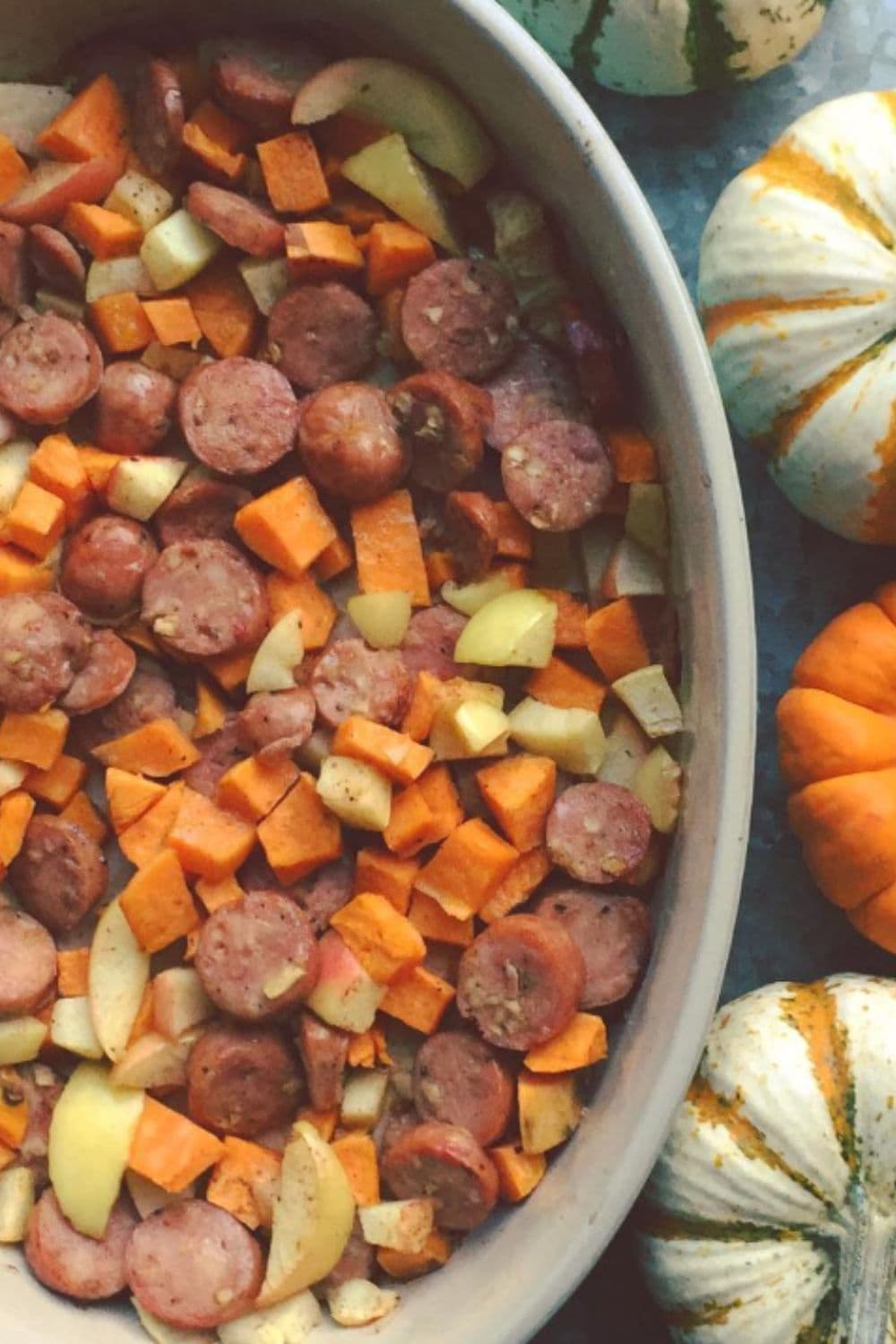 Chicken sausage, sweet potatoes, and apples roasted together in one pan, one of those dump and bake recipes that gives all the cozy fall vibes.