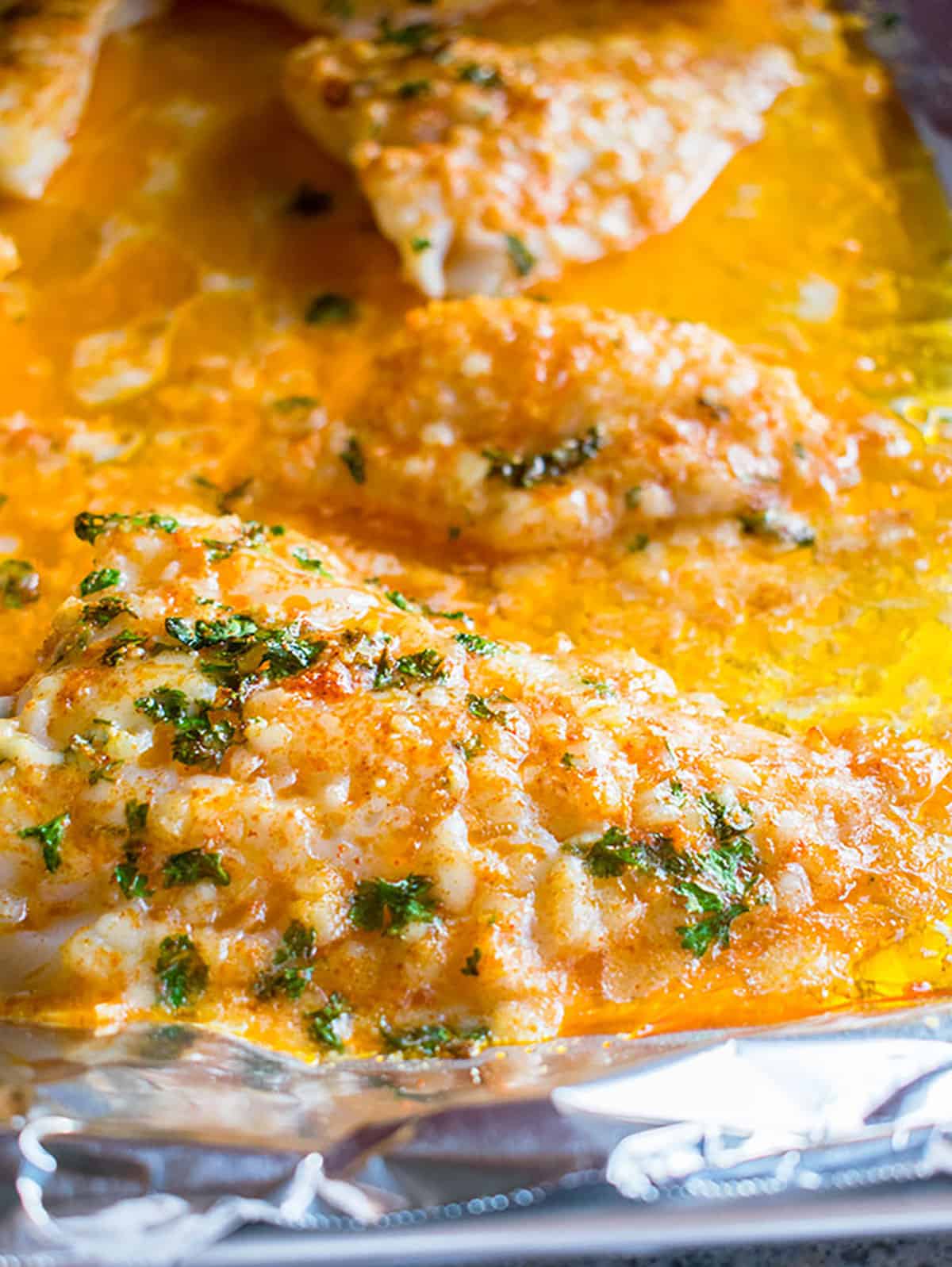 Baked cod with parmesan crust served with greens, a light high protein meal