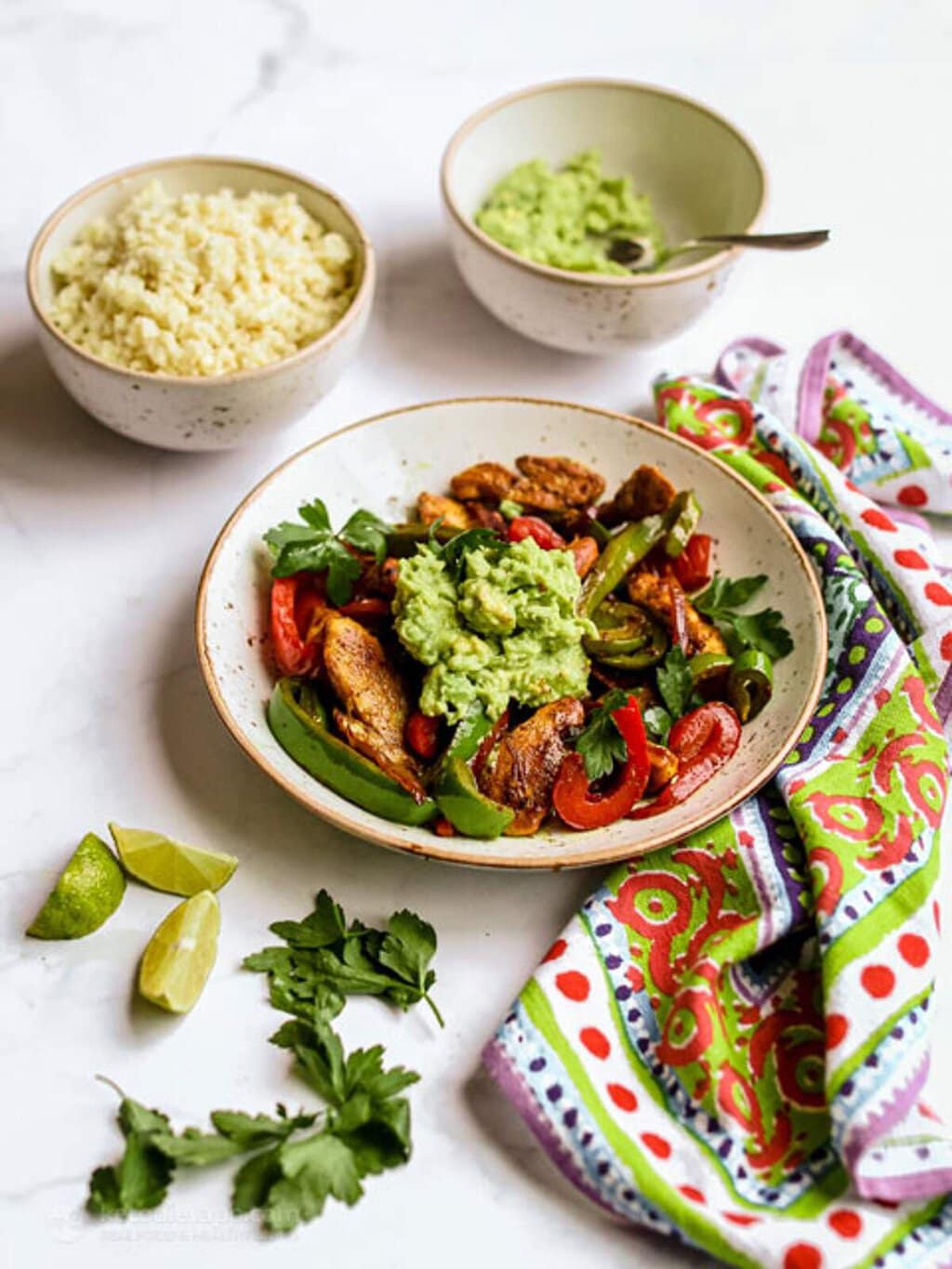 Chicken fajita bowl with peppers and toppings, a high protein low calorie dinner