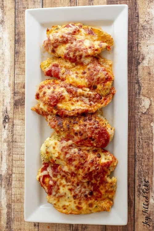Keto chicken parmesan topped with marinara and melted cheese, a high protein low calorie meal