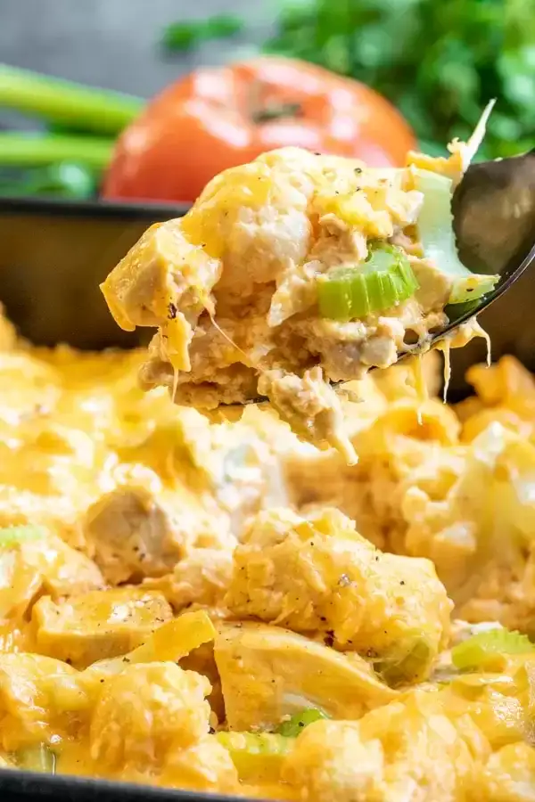 Buffalo chicken cauliflower casserole baked with cheese, a high protein low calorie comfort meal